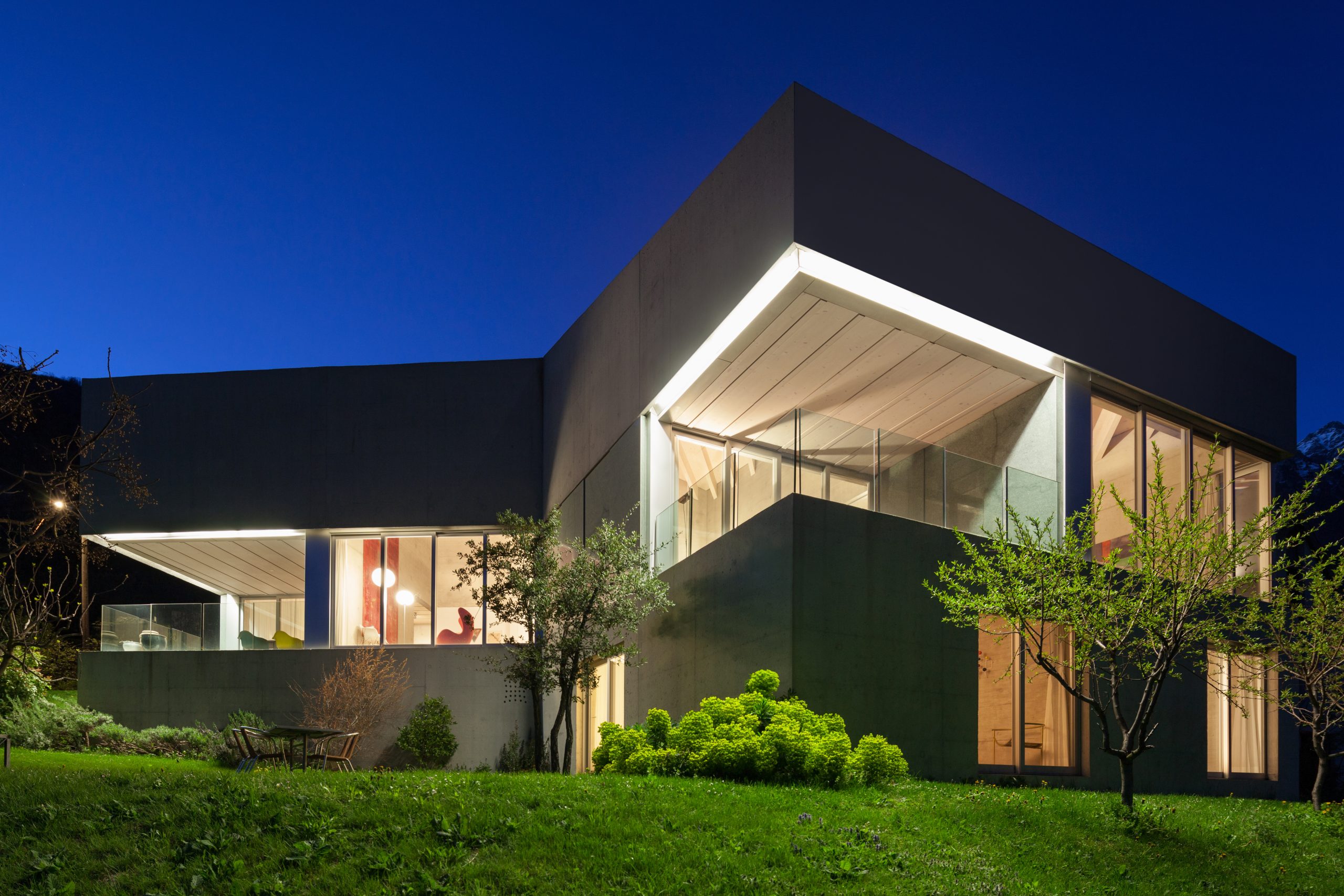 Sleek, modern house with picture windows and quaker windows