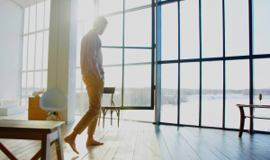Man walking in front of quaker window